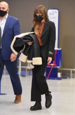 DAKOTA JOHNSON Arrives at JFK Airport in New York 12/04/2021