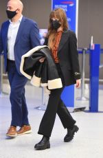 DAKOTA JOHNSON Arrives at JFK Airport in New York 12/04/2021