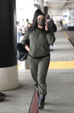 FAITH EVANS Arrives at LAX Airport in Los Angeles 12/22/2021