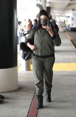 FAITH EVANS Arrives at LAX Airport in Los Angeles 12/22/2021
