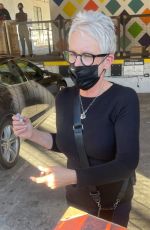 JAMIE LEE CURTIS Signs for Fans at an Event in Los Angeles 12/11/2021