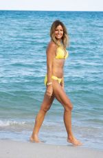 KELLY BENSIMON in a Yellow Bikini Out at a Beach in Miami 12/04/2021