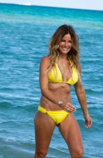 KELLY BENSIMON in a Yellow Bikini Out at a Beach in Miami 12/04/2021