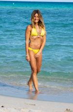 KELLY BENSIMON in a Yellow Bikini Out at a Beach in Miami 12/04/2021