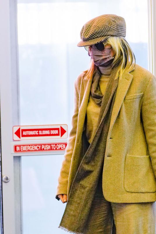 MILEY CYRUS Arrives at JFK Airport in New York 12/12/2021