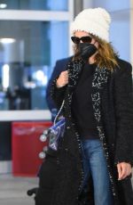 PENELOPE CRUZ Arrives at JFK Airport in New York 12/13/2021
