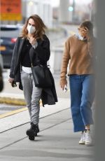 SIENNA MILLER and CARA DELEVINGNE at JFK Airport in New York 12/30/2021