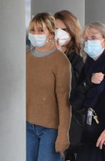 SIENNA MILLER and CARA DELEVINGNE at JFK Airport in New York 12/30/2021
