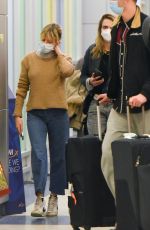 SIENNA MILLER and CARA DELEVINGNE at JFK Airport in New York 12/30/2021