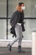 SIENNA MILLER and CARA DELEVINGNE at JFK Airport in New York 12/30/2021