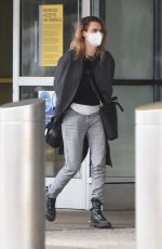 SIENNA MILLER and CARA DELEVINGNE at JFK Airport in New York 12/30/2021