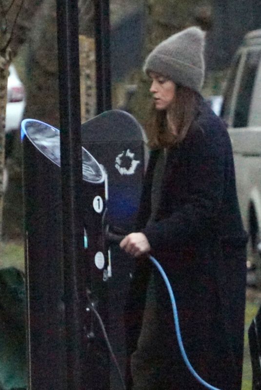 CLAIRE FOY Charges Her Electric Car Out in Hampstead 01/18/2022