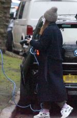 CLAIRE FOY Charges Her Electric Car Out in Hampstead 01/18/2022