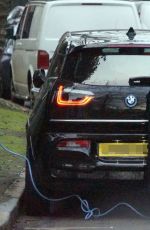 CLAIRE FOY Charges Her Electric Car Out in Hampstead 01/18/2022