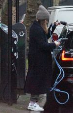 CLAIRE FOY Charges Her Electric Car Out in Hampstead 01/18/2022