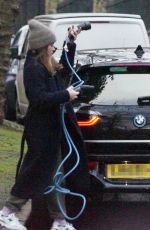 CLAIRE FOY Charges Her Electric Car Out in Hampstead 01/18/2022