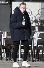 DAKOTA FANNING Holding a Bottle of Wine Out in Venice 01/22/2022
