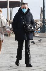 DAKOTA FANNING Taking a Break with Friends in Venice 01/21/2022