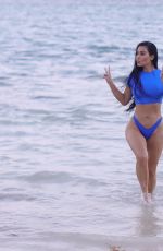 KIM KARDASHIAN in Bikini at a Photoshoot for Her SKIMS Swimwear Line 01/18/2022