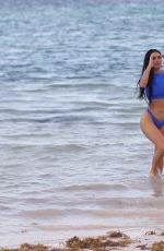 KIM KARDASHIAN in Bikini at a Photoshoot for Her SKIMS Swimwear Line 01/18/2022