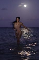 KIM KARDASHIAN in Swmisuit at Evening Photoshoot for Her Skims Swimwear Line 01/18/2022