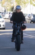 MALIN AKERMAN Rides Her Electric Motorcycle Out in Los Angeles 01/21/2022