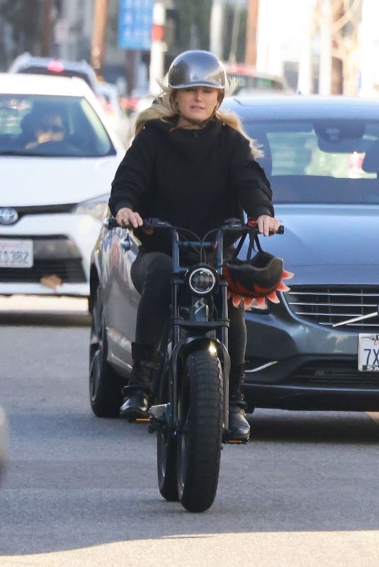 MALIN AKERMAN Rides Her Electric Motorcycle Out in Los Angeles 01/21/2022