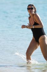 RHEA DURHAM in Black Swimsuit at Beach in St. James Parish 01/03/2022