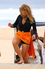 RITA ORA at a Photoshoot on the Beach in Sydney 01/17/2022