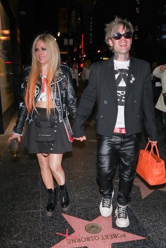 AVRIL LAVIGNE and Mod Suna Arrives at Mod’s Documentary Remember Me Just Like This Screening in Los Angeles 02/18/2022