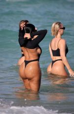CHANEY JONES and BIANCA ELOUISE in Swimsuit at a Beach in Miami 02/23/2022