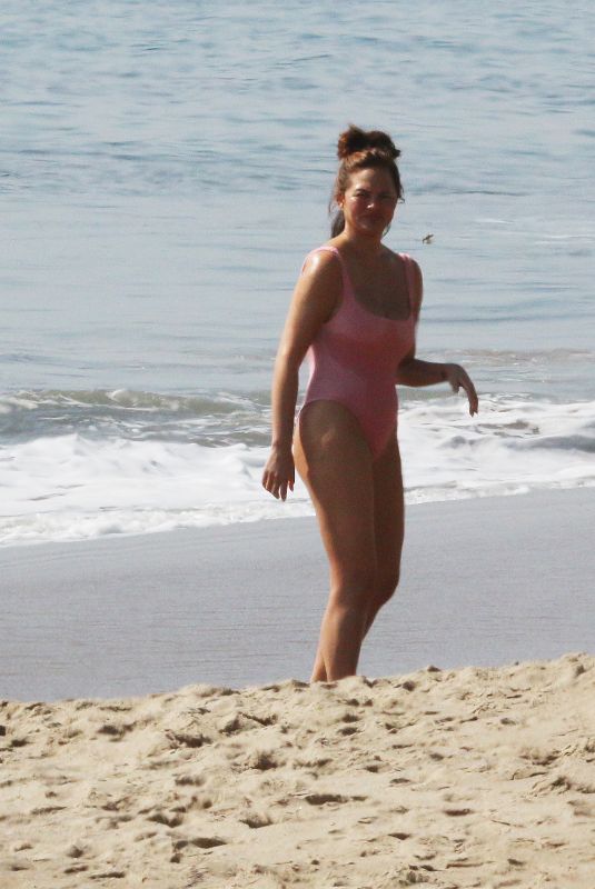 CHRISSY TEIGEN in Bikini at a Beach in Malibu 02/21/2022