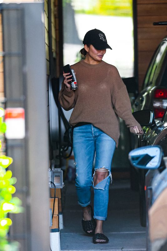 CHRISSY TEIGEN in Ripped Denim Out in West Hollywood 02/16/2022