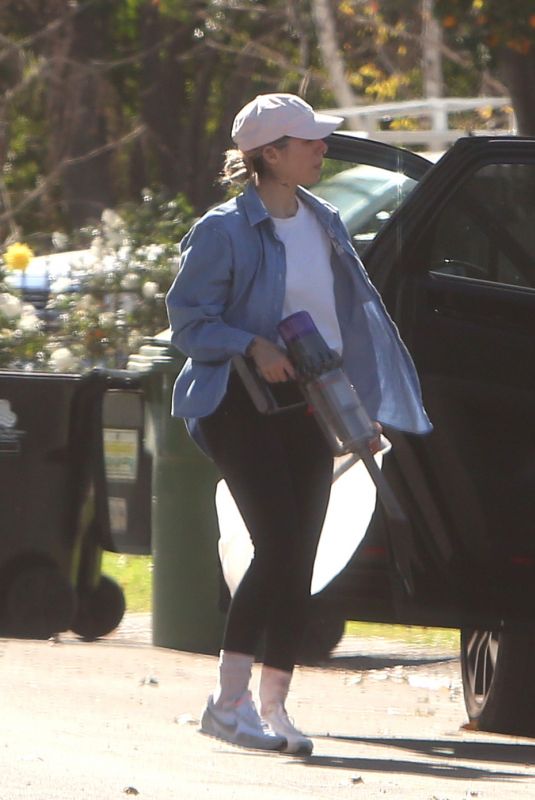 CHRISTINA PERRI Vacuums Her Car and Packs it with Luggage in Los Angeles 02/02/2022