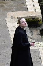 DAKOTA FANNING Enjoys a Glass of Red Wine in Venice 02/05/2022