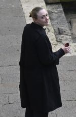 DAKOTA FANNING Enjoys a Glass of Red Wine in Venice 02/05/2022