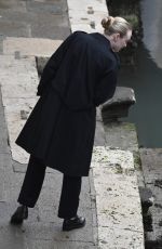 DAKOTA FANNING Enjoys a Glass of Red Wine in Venice 02/05/2022