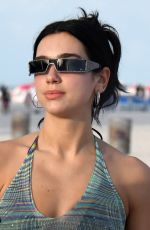 DUA LIPA in a Black Bikini Under a Sheer Cover-up Out in Miami 02/05/2022