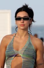 DUA LIPA in a Black Bikini Under a Sheer Cover-up Out in Miami 02/05/2022