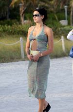 DUA LIPA in a Black Bikini Under a Sheer Cover-up Out in Miami 02/05/2022