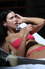 DUA LIPA in a Pink Bikini at a Pool in Miami 02/06/2022