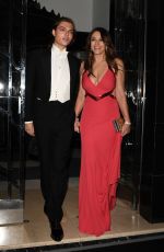 ELIZABETH HURLEY Leaves Joan Collins