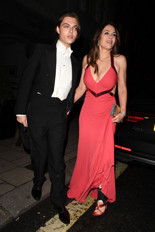 ELIZABETH HURLEY Leaves Joan Collins