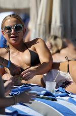 KATE HUDSON in a Black Bikini at a Beach in Miami 02/27/2022