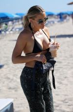 KATE HUDSON in a Black Bikini at a Beach in Miami 02/27/2022