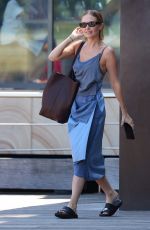 LARA BINGLE Leaves Her Hotel in Sydney 02/20/2022