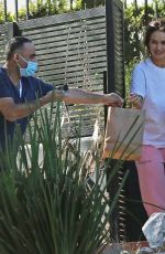 LILY JAMES Has Food Delivered to Her Home in Los Angeles 02/02/2022