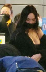 MEGAN FOX and Machine Gun Kelly at LAX Airport in Los Angeles 02/11/2022