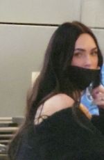 MEGAN FOX and Machine Gun Kelly at LAX Airport in Los Angeles 02/11/2022