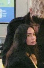 MEGAN FOX and Machine Gun Kelly at LAX Airport in Los Angeles 02/11/2022